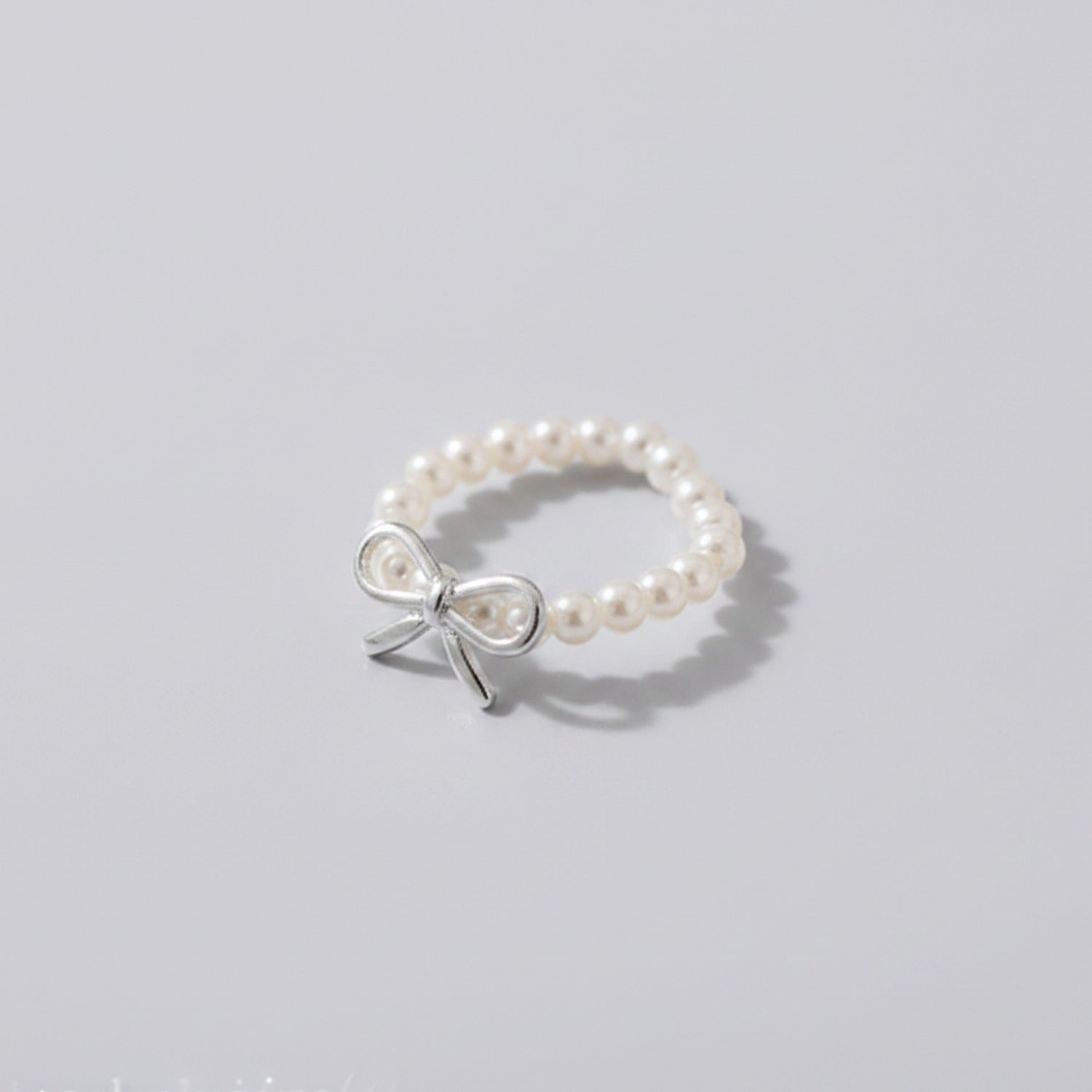 Pearl Beaded Ring With Silver Bow Charm