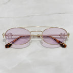 Oval Sunglasses With Geometric Temple Details - Gold Frame Purple Lens – eyewear (view 2)