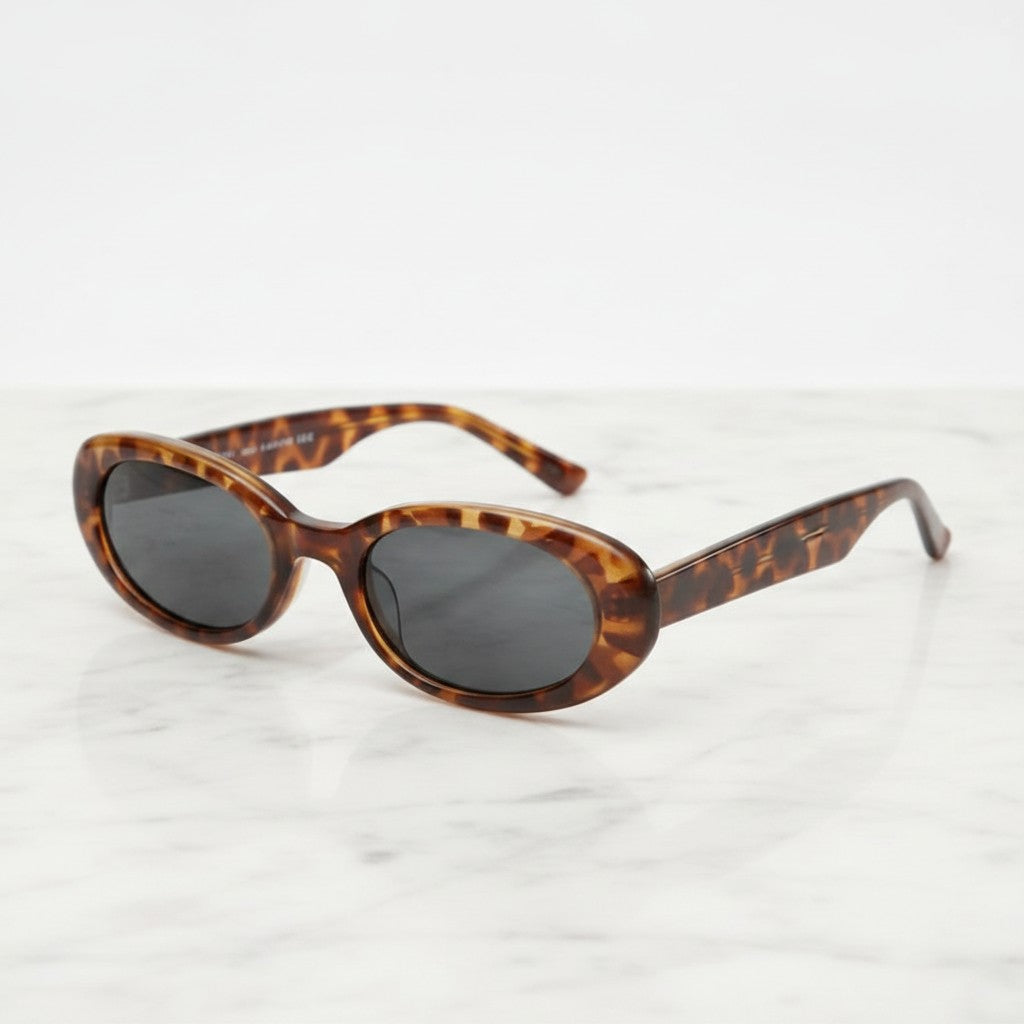Tortoiseshell Oval Sunglasses with Dark Lenses - Tortoiseshell Frame - Color Variation – eyewear (view 3)