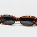 Tortoiseshell Oval Sunglasses with Dark Lenses - Tortoiseshell Frame - Color Variation – eyewear (view 1)