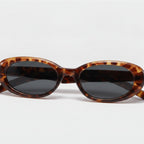 Tortoiseshell Oval Sunglasses with Dark Lenses - Tortoiseshell Frame - Color Variation – eyewear (view 1)