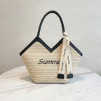 Beige Straw Tote Bag With Black Handles And Ribbon Charm – bags & wallets (view 2)