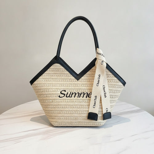 Beige Straw Tote Bag With Black Handles And Ribbon Charm