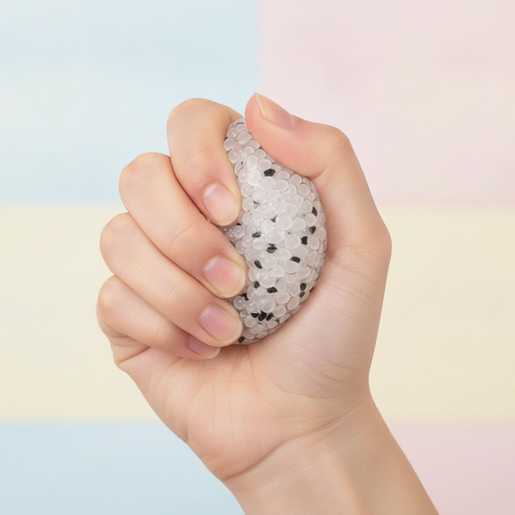 Speckled Squishy Ball - Cream Speckle - squeeze in hand