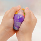 Squishy Stress Ball - Pink, Yellow & Blue - squeeze in hand