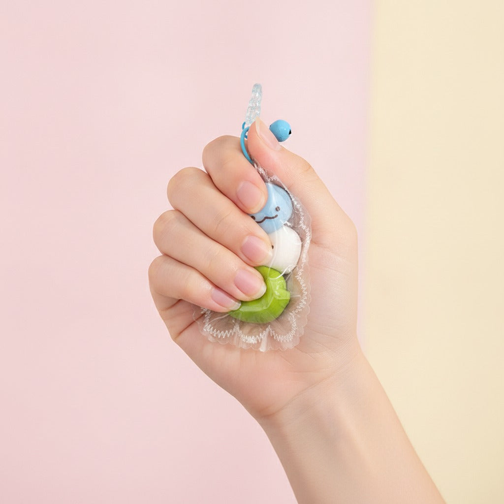 Stacked Squishy Charm Keychain - Yellow & Pink - squeeze in hand
