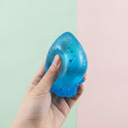 Glitter Water Drop Squishy - Purple - squeeze in hand