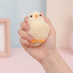 Cream Chick Squishy Trio With Wood Base - squeeze in hand