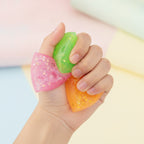 Glitter Triangle Cheese Squishy - Green - squeeze in hand