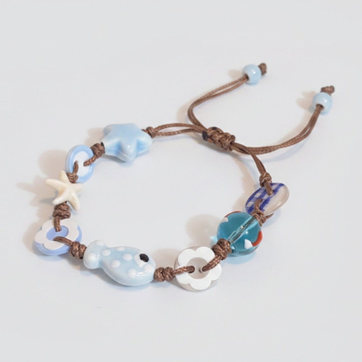 Blue Ceramic Charm Bracelet With Starfish Beads – jewelry (view 1)
