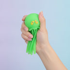 Green Jellyfish Suction Cup Toy - squeeze in hand