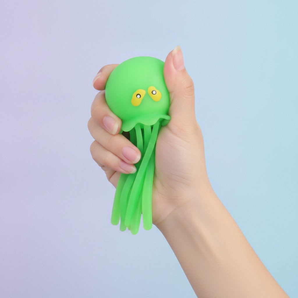 Green Jellyfish Suction Cup Toy - squeeze in hand