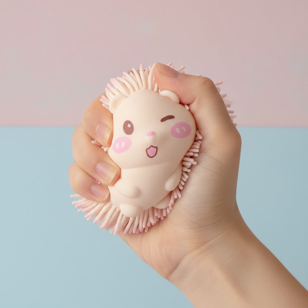 Peach Hedgehog Rubber Spiky Toy - squeeze in hand