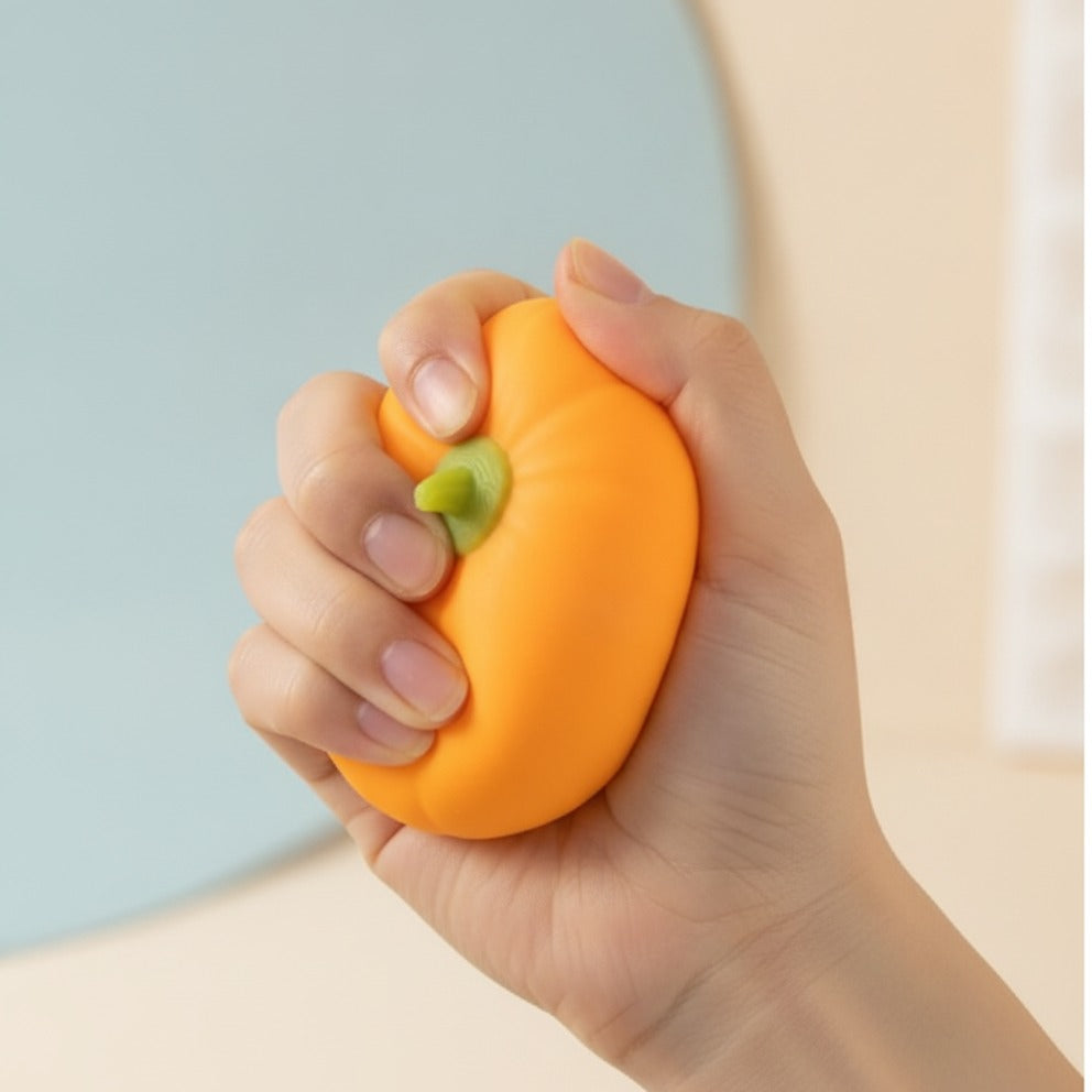 Mini Orange Pumpkin Stress Relief Squeeze Toy - squeeze in hand