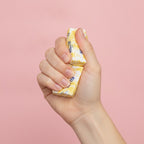 4oz Salted Butter Sticks Yellow Swirl Design - squeeze in hand