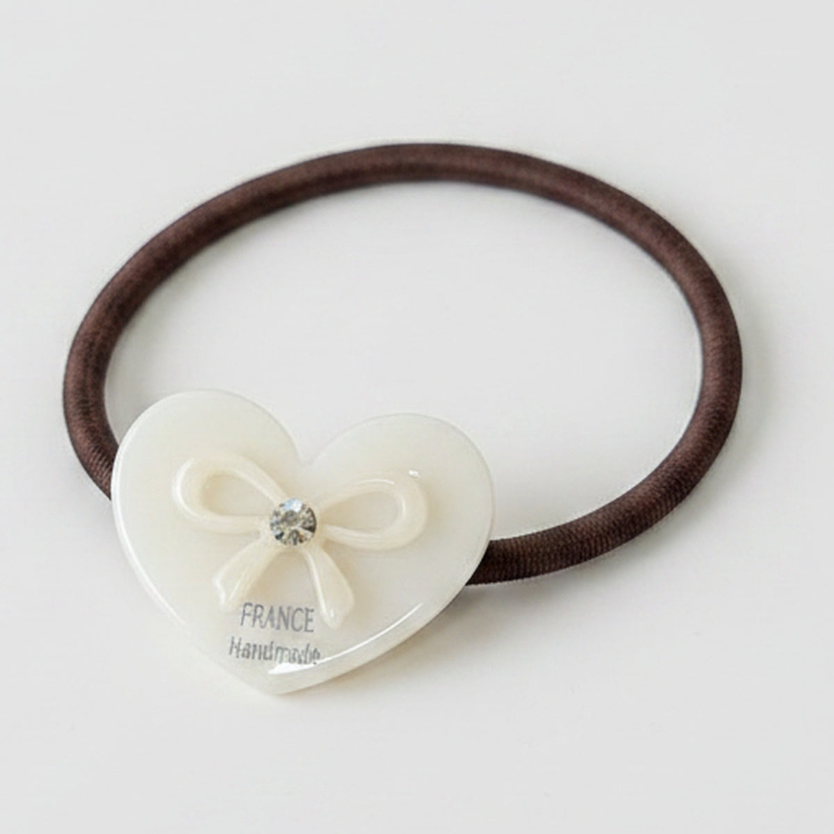 Heart-Shaped Hair Tie With Bow Charm – hair accessories (view 1)