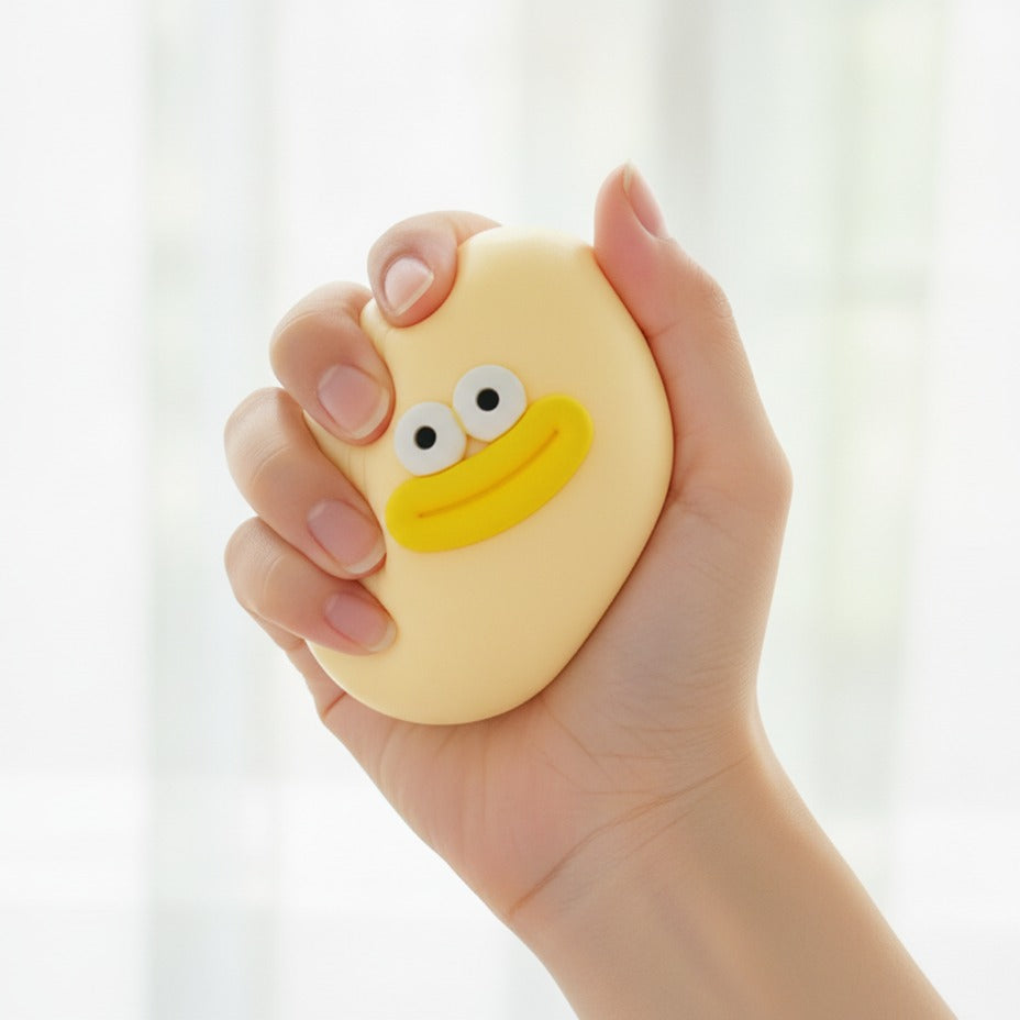 Duck Face Rubber Ball - Yellow - squeeze in hand