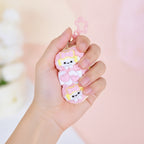 Paw Print Bone Squishy Keychain - Purple - squeeze in hand