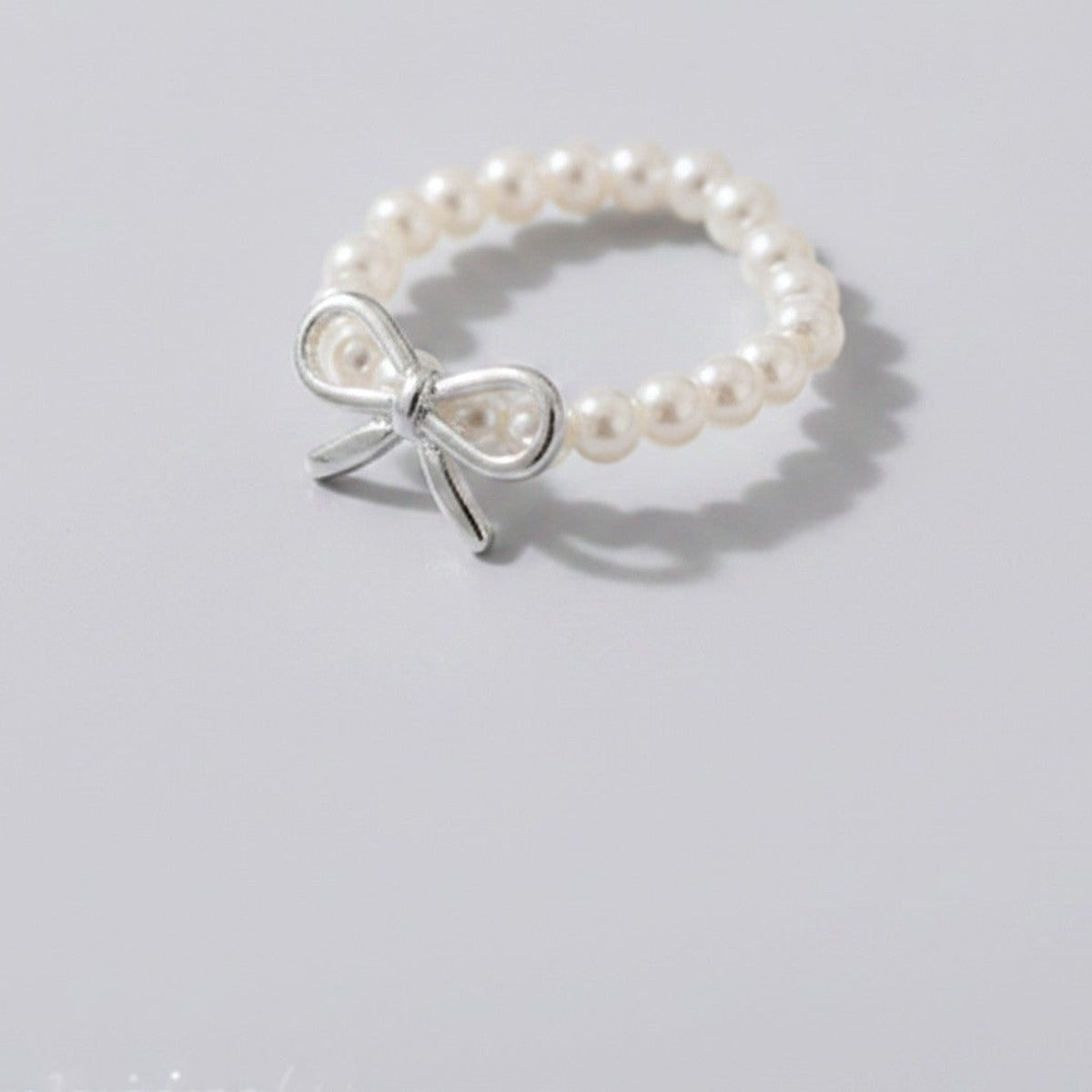 Pearl Beaded Ring With Silver Bow Charm – jewelry (view 1)