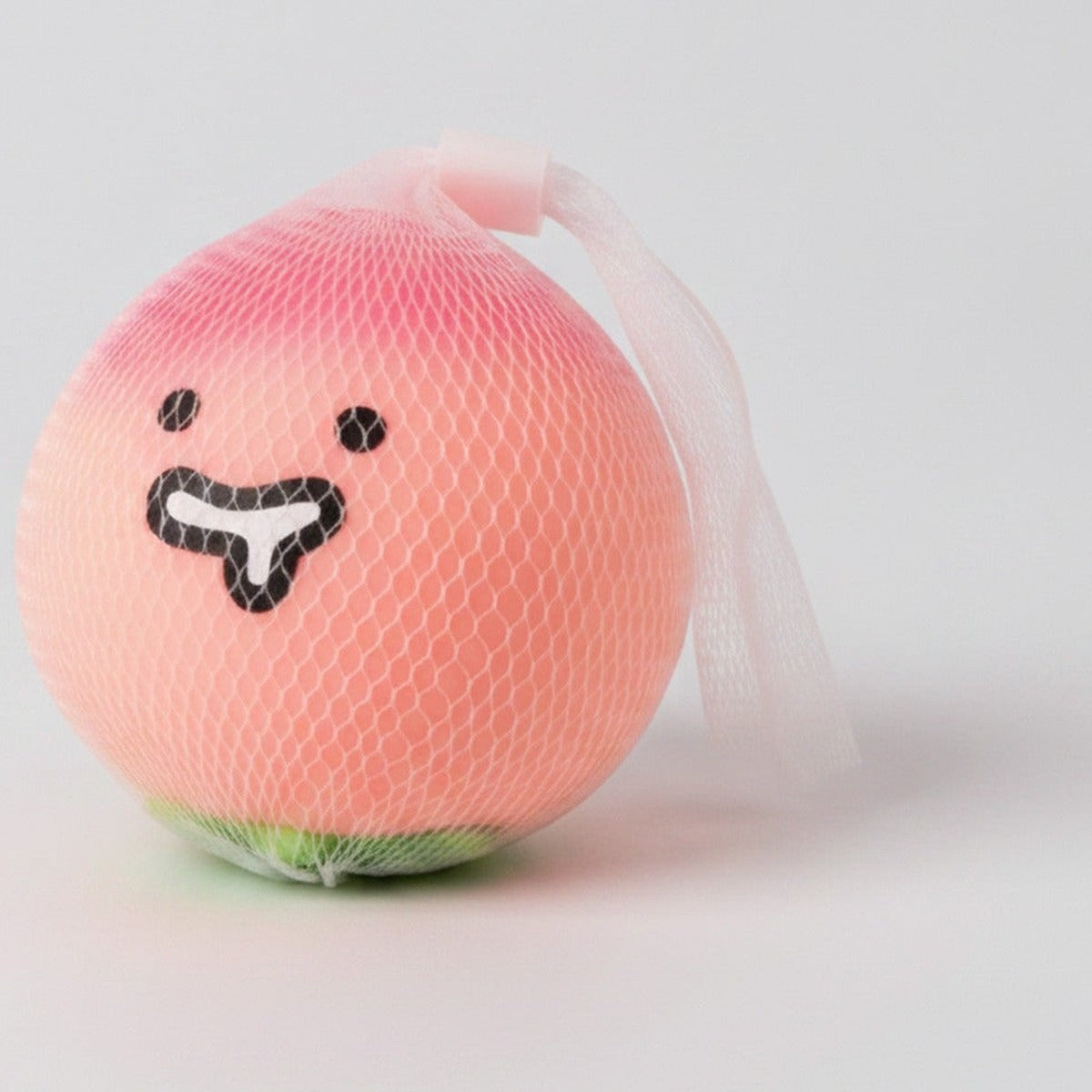 Pink Lychee Squishy With Smiling Face Charm – novelty & toys (view 1)
